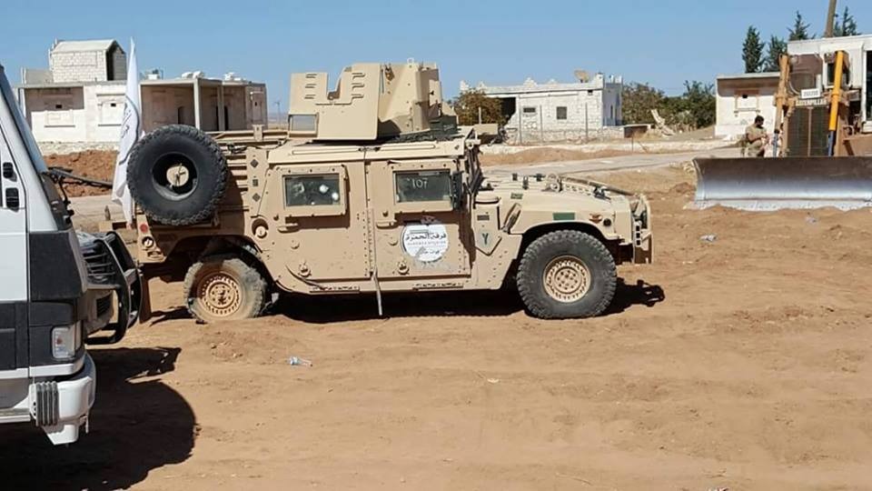 US vehicle operated in Aleppo by the FSA with Arabic writing that reads in English: "Al Hamza Division: Free Syrian Army"