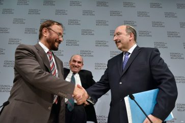 Saudi General Anwar Eshqi shakes hands with Zionist PM Benjamin Netanyahu's top advisor and General Director of the foreign ministry Doori Gold