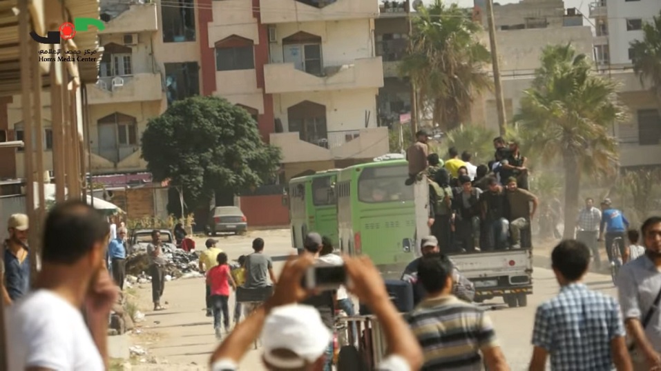 Buses carrying militants in Homs