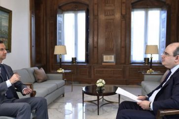 President Bashar al-Assad during interview with Syrian daily al-Watan