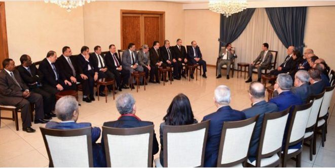 Syrian President Bashar Assad receiving the Arab Lawyers delegation