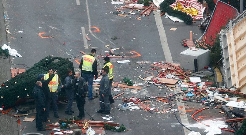 Policemen investigating the scene of the terrorist act