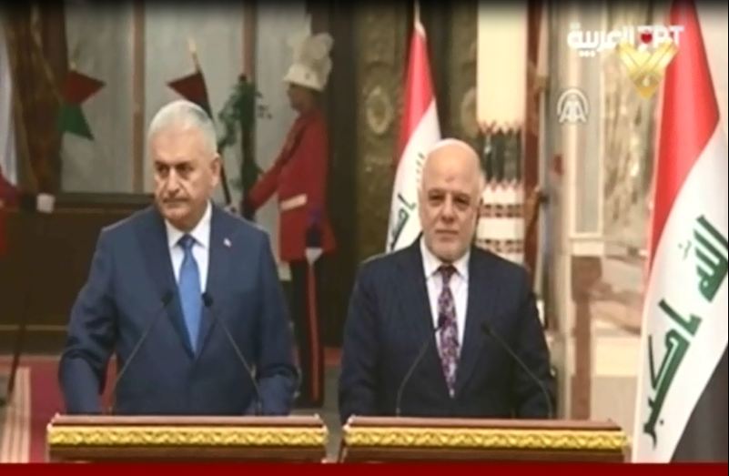 Iraqi Prime Minister Haidar Abadi and his Turkish counterpart Binali Yildirim dudring their jont press conference in Baghdad on January 7