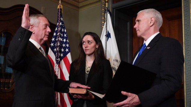 US Vice President Mike Pence, right, swears in James Mattis (L) as US Secretary of Defense in the Vice President's Ceremonial Office in the Old Executive Office Building in Washington, DC, January 20, 2017