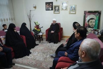 Rouhani visits Iranian martyrs families