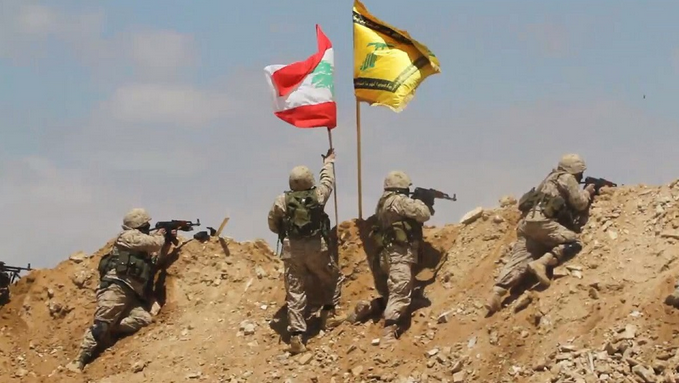 Resistance fighters planting Lebanon's and Hezbollah flags over peaks of northeastern borders after defeating the terrorists