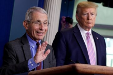 National Institute of Allergy and Infectious Diseases director Dr. Anthony Fauci speaks as U.S. President Donald Trump listens during the coronavirus response daily briefing at the White House in Washington, U.S., April 10, 2020. REUTERS/Yuri Gripas