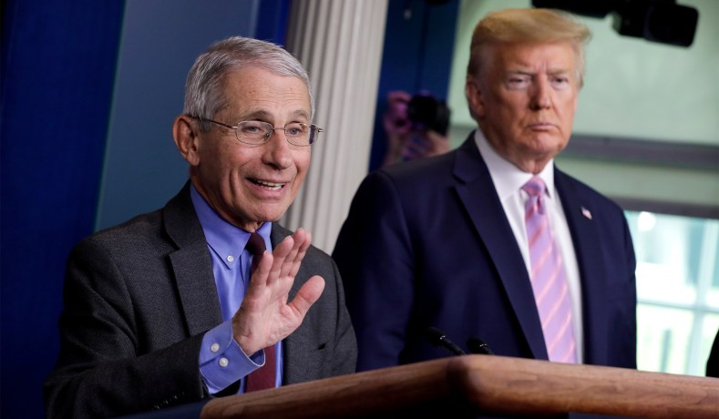 National Institute of Allergy and Infectious Diseases director Dr. Anthony Fauci speaks as U.S. President Donald Trump listens during the coronavirus response daily briefing at the White House in Washington, U.S., April 10, 2020. REUTERS/Yuri Gripas