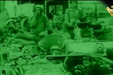 Israeli occupation forces on top of an armored vehicle during July War in 2006