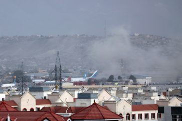 Smoke rises from explosion outside the airport in Kabul, Afghanistan, Thursday, Aug. 26, 2021. The explosion went off outside Kabul’s airport, where thousands of people have flocked as they try to flee the Taliban takeover of Afghanistan. Officials offered no casualty count, but a witness said several people appeared to have been killed or wounded Thursday. (AP Photo/Wali Sabawoon)