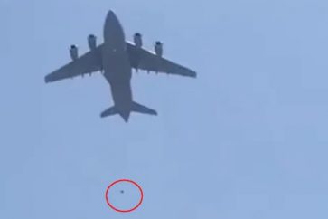 Two People Tie Themselves to Wheels of US Aircraft