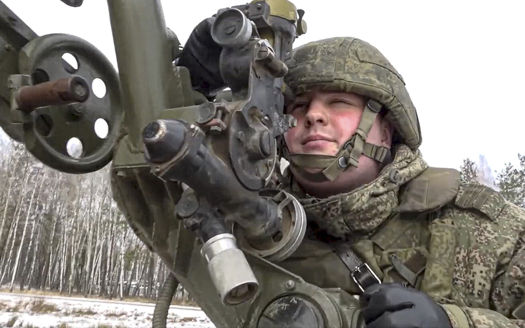 In this photo taken from video and released by the Russian Defense Ministry Press Service on Friday, Feb. 4, 2022, a soldier takes part in the Belarusian and Russian joint military drills at Brestsky firing range, Belarus. Russian and Belarus troops held joint combat training at firing ranges in Belarus. The drills involved motorized rifle, artillery and anti-tank missile units, as well tanks and armored personnel carriers crews. (Russian Defense Ministry Press Service via AP)
