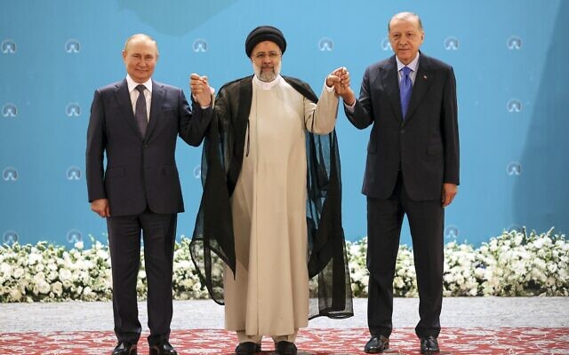 Russian President Vladimir Putin, left, Iranian President Ebrahim Raisi, center, and Turkish President Recep Tayyip Erdogan pose for a photo prior to their talks at the Saadabad palace, in Tehran, Iran, Iran, Tuesday, July 19, 2022. (Sergei Savostyanov, Sputnik, Kremlin Pool Photo via AP)