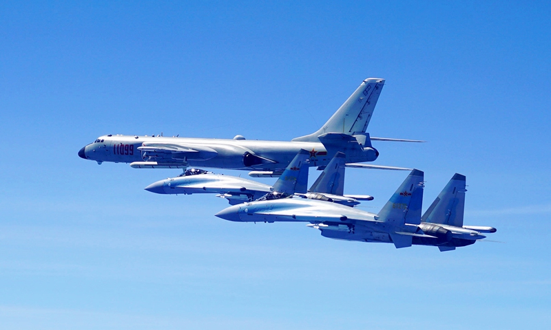 (180511) -- GUANGZHOU, May 11, 2018 (Xinhua) -- Two Su-35 fighter jets and a H-6K bomber fly in formation on May 11, 2018.
The People's Liberation Army (PLA) air force conducted patrol training over China's island of Taiwan on Friday.
Su-35 fighter jets flew over the Bashi Channel in formation with the H-6Ks for the first time, which marks a new breakthrough in island patrol patterns, said Shen Jinke, spokesperson for the PLA air force. (Xinhua/Han Chao) (lmm)