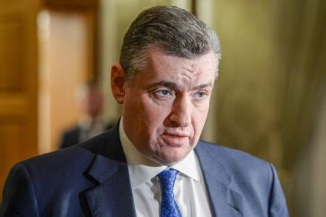 GOMEL REGION, BELARUS - FEBRUARY 28, 2022: Russian State Duma International Affairs Committee chairman Leonid Slutsky talks to journalists after Russian-Ukrainian talks. On 27 February, an agreement was reached with the Ukrainian side about talks in the Gomel Region of Belarus in connection with the Russian military operation in Ukraine. Early on 24 February, Russia's President Putin announced his decision to launch a special military operation after considering requests from the leaders of the Donetsk People's Republic and Lugansk People's Republic. Alexander Kryazhev/POOL/TASSÁåëîðóññèÿ. Ãîìåëüñêàÿ îáëàñòü. Ãëàâà êîìèòåòà Ãîñäóìû ÐÔ ïî ìåæäóíàðîäíûì äåëàì Ëåîíèä Ñëóöêèé âî âðåìÿ ïðåññ-ïîäõîäà ïî îêîí÷àíèè ïåðâîãî ðàóíäà ðîññèéñêî-óêðàèíñêèõ ïåðåãîâîðîâ. 27 ôåâðàëÿ ñ óêðàèíñêîé ñòîðîíîé áûëà äîñòèãíóòà äîãîâîðåííîñòü î ïðîâåäåíèè ïåðåãîâîðîâ â Ãîìåëüñêîé îáëàñòè Áåëîðóññèè íà ôîíå ïðîâåäåíèÿ îáúÿâëåííîé 24 ôåâðàëÿ ïðåçèäåíòîì ÐÔ Âëàäèìèðîì Ïóòèíûì ñïåöèàëüíîé âîåííîé îïåðàöèè íà Óêðàèíå â îòâåò íà îáðàùåíèå ðóêîâîäèòåëåé ðåñïóáëèê Äîíáàññà (ÄÍÐ è ËÍÐ) î ïîìîùè. Àëåêñàíäð Êðÿæåâ/POOL/ÒÀÑÑ