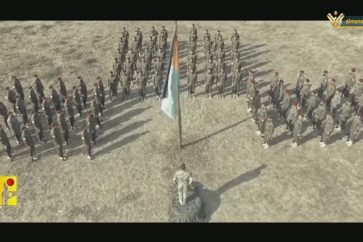 Hezbollah fighters saluting Palestine's flag