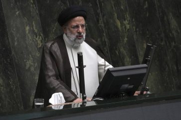Iranian President Ebrahim Raisi addresses the parliament in a vote of confidence session for his proposed labor minister in Tehran, Iran, Tuesday, Oct. 4, 2022. (AP Photo/Vahid Salemi)