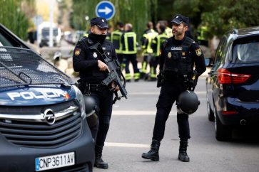 Police stands outside of Ukrainian embassy after, Spanish police said, blast at embassy building injured one employee while handling a letter, in Madrid, Spain November 30, 2022. REUTERS/Juan Medina