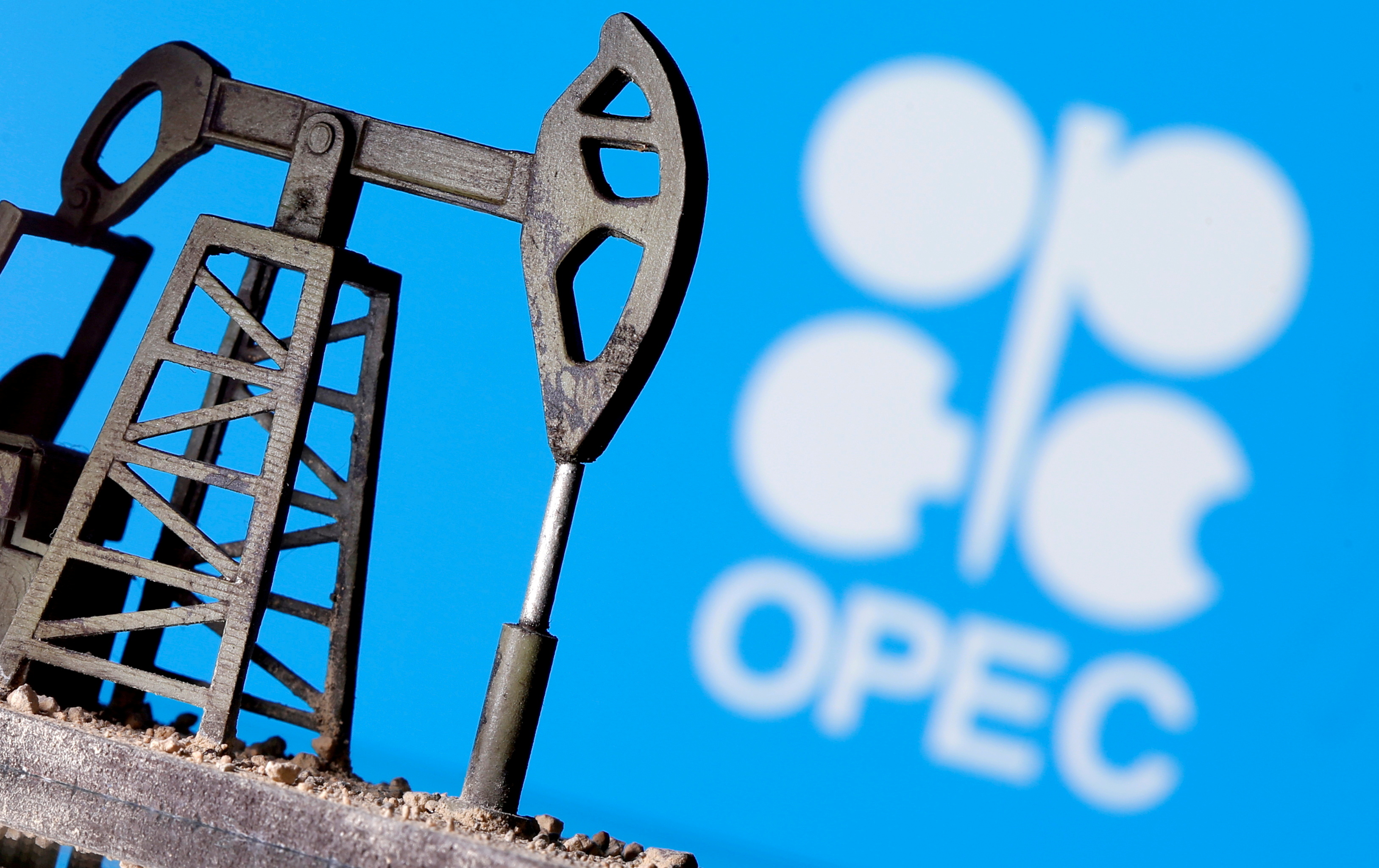 FILE PHOTO: A 3D-printed oil pump jack is seen in front of a displayed OPEC logo in this illustration picture, April 14, 2020. REUTERS/Dado Ruvic