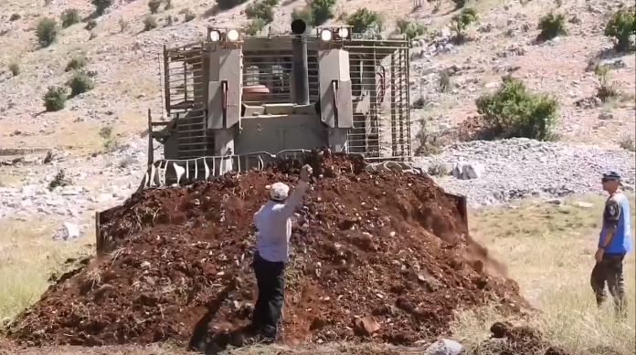 Lebanese farmer Esmail Nasser heroically confronts an Israeli bulldozer
