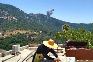 A resilient woman from the south of Lebanon effortlessly runs errands despite Israeli aggression
