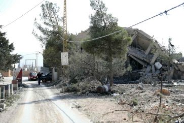 A destroyed building stands next to an abandoned Lebanese army checkpoint in the aftermath of an overnight Israeli airstrike that targeted Baalbeks al-Charawneh neighborhoud in Lebanon's eastern Bekaa valley on November 2, 2024. Lebanon's health ministry said that 52 people were killed and 72 wounded in Israeli strikes on November 1, in the country's eastern Baalbek-Hermel region, attacks for which the Israeli army had not issued evacuation warnings. (Photo by AFP)