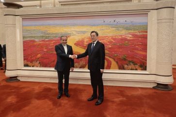 Iranian Foreign Minister Abbas Araqchi (L) meets with the first-ranked vice premier of China, Ding Xuexiang, in Beijing on April 23, 2025.