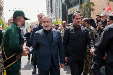 Iranian FM Abbas Araghchi participating in public funeral