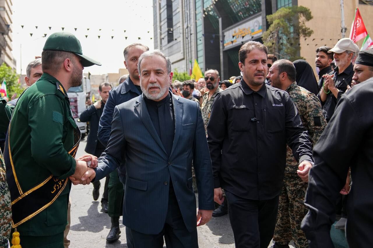 Iranian FM Abbas Araghchi participating in public funeral