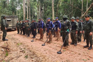 Thai soldiers inspect a border area in Ubon Ratchathani province where they claim to have found two anti-personnel landmines. Photograph: AP