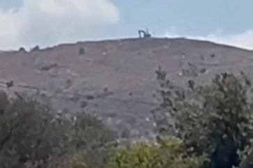 Israeli bulldozer expanding an occupation site in Aitaroun town
