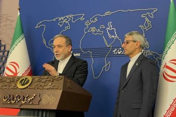 Foreign Minister Abbas Araqchi (L) joins spokesperson Esmaeil Baqaei during the ministry's weekly press briefing in Tehran, August 4, 2025.